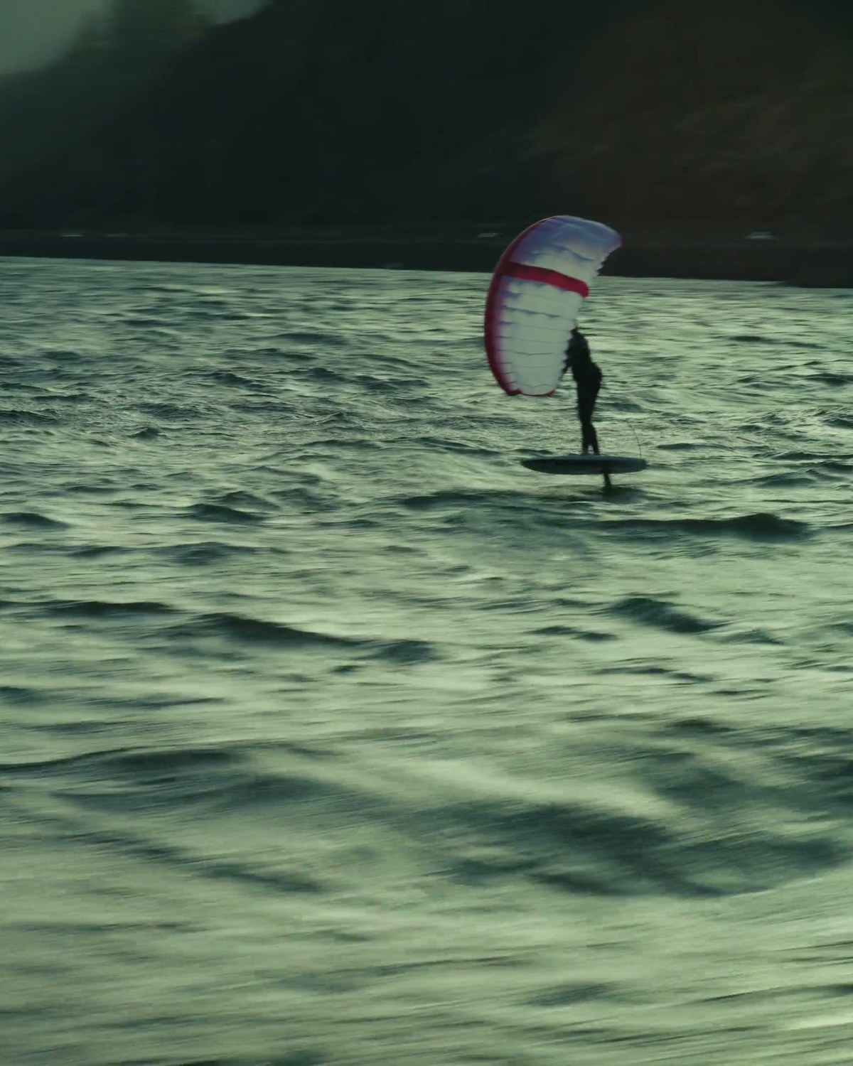 Kite foiler on open water