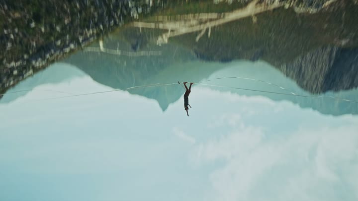 Highliner over a canyon, inverted