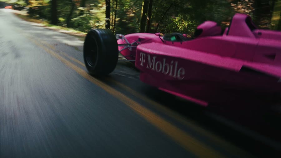 Open-wheel race car at speed